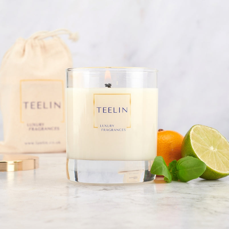 Candle with lime, mandarin, basil, gold lid and cotton bag