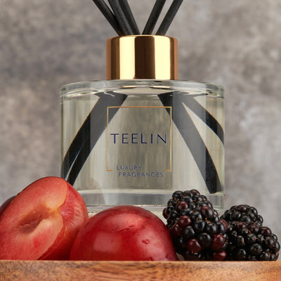 Reed diffuser with plums and blackberries