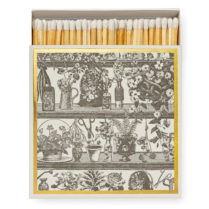 Luxury white matches in a square matchbox featuring The Potting Shed design.